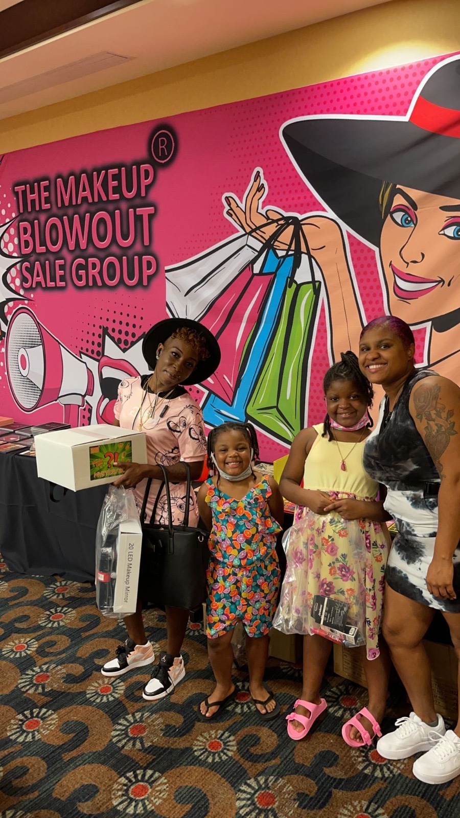 Family with mystery boxes at the pop-art booth
