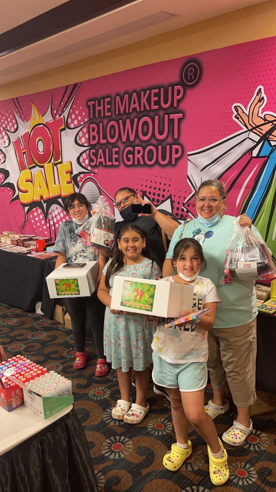 Group of customers with mystery boxes and gift bags