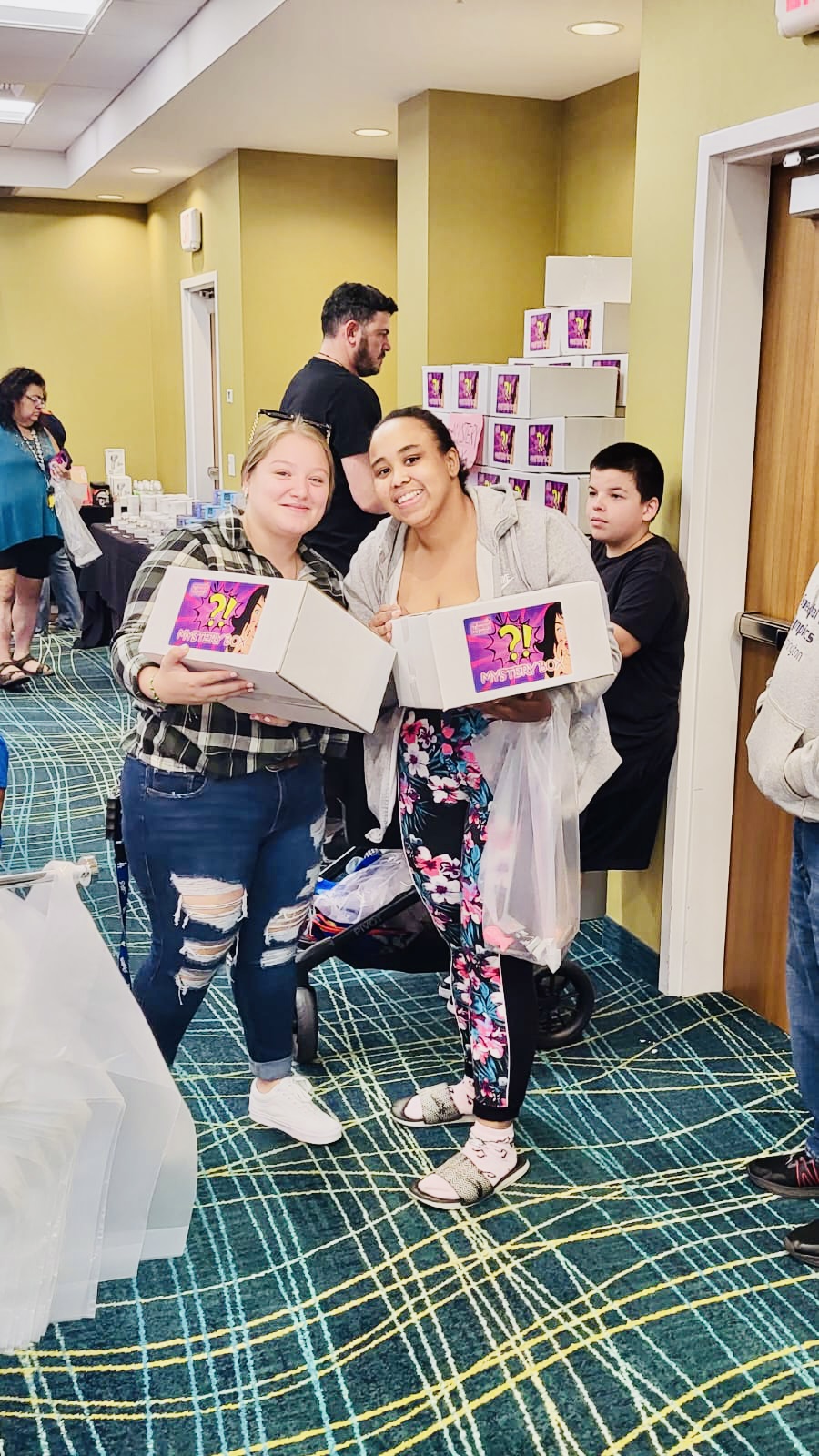 Customers smiling with their mystery boxes
