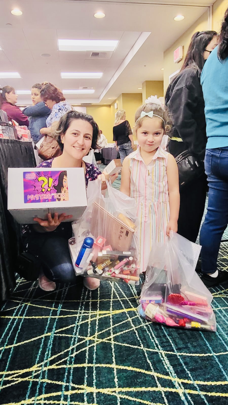 Mom and daughter with a mystery box and goodies