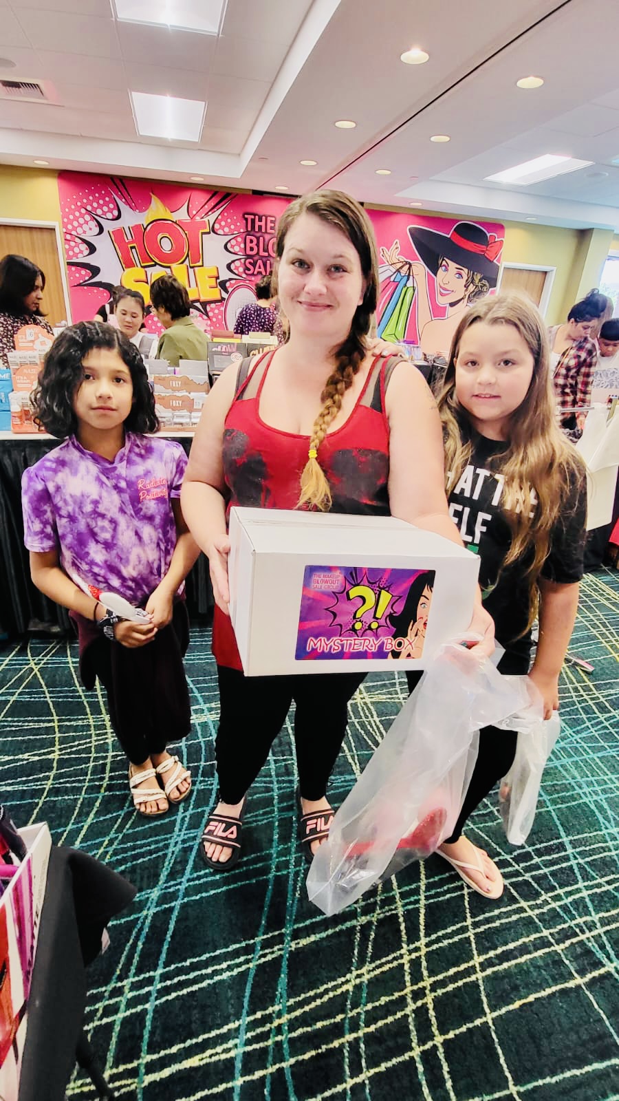 Family holding their mystery box