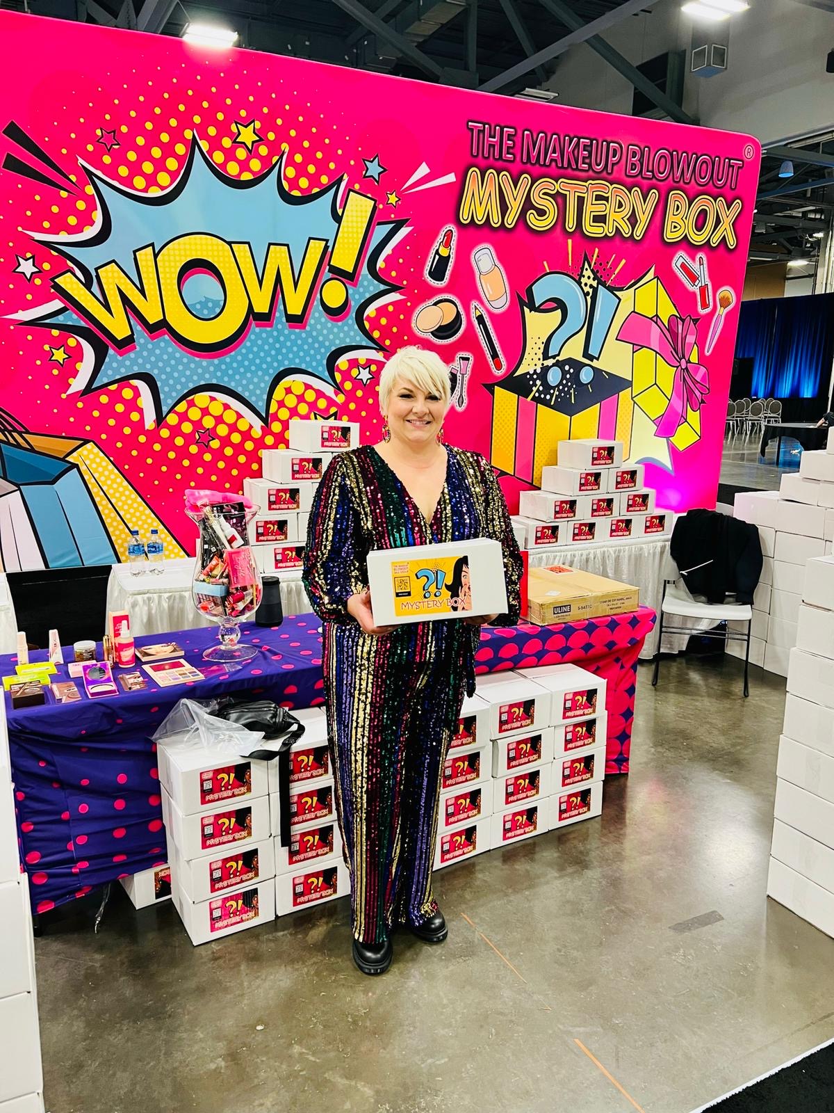 Happy customer holding a mystery box at the WOW booth